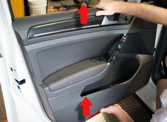 5. Once the clips have been released, pull the door panel upwards.