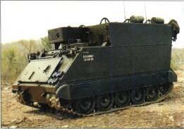 United Defense M113A2 APC (USA) KEY RECOGNITION FEATURES Box-shaped hull with front sloping at 60 to rear, horizontal roof, vertical hull rear with large power-operated ramp, vertical hull sides with