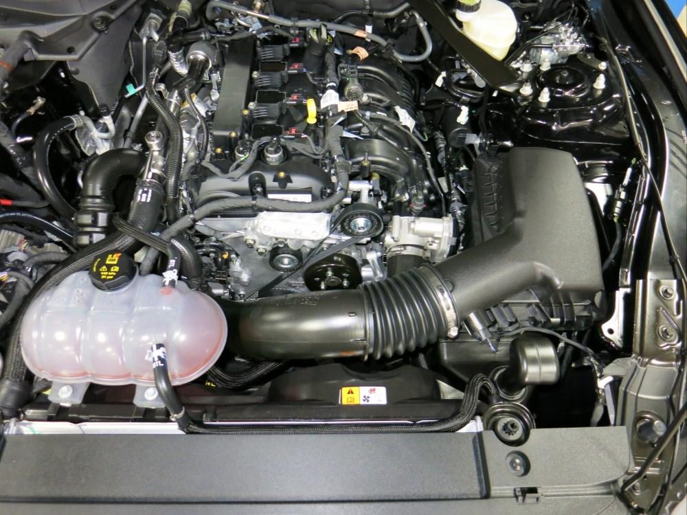 e. Install the hot-side charge pipe assembly onto the turbo outlet and intercooler inlet simultaneously. Ensure that both couplers have adequate engagement at the sealing surfaces.