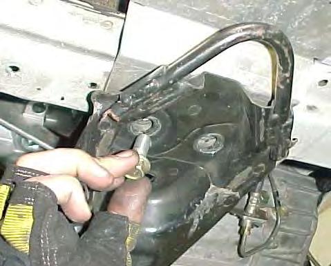 Replace the hardware mounting the cradle to the lower engine mount and the front of the cradle to the