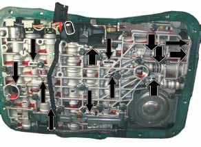 Timing valve may be stuck toward the end plug or the spring is not on center, which causes it to coil bind. Kickdown valve may be stuck or spring missing.