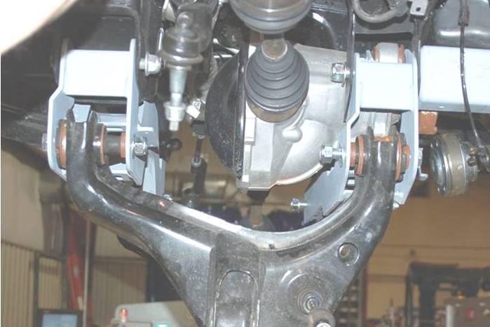 Install the front cross-member using the factory hardware.