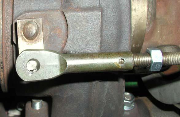 Thread the clevis out until it slides on the pin easily, then turn the clevis back 1.5 turns to set the preload.