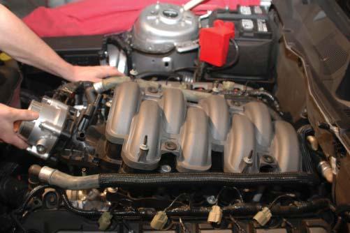 Using an 8mm socket wrench, remove the remaining six intake manifold