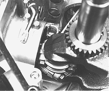 ) Crankcase Cover Bearing.... 16.07 mm (0.633 in.) M53975b 2. Remove connecting rod caps and push pistons to top of cylinder. Remove crankshaft.