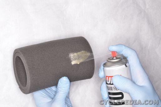 Place the filter in a container and saturate it with a foam air filter cleaner both inside and out.