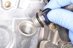 Add the proper type and quantity of oil and install the oil filler cap. Start the engine and let it run for several minutes.