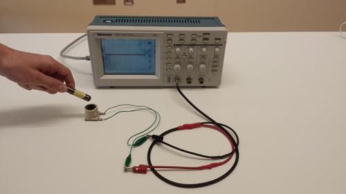 Figure 3: Solenoid and Oscilloscope 3 With the solenoid on the lab tabletop, investigate its interaction with the cylindrical magnet (see Figure 3).