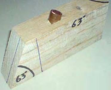 This shows a magnetic gate arrangement built on a flat piece of Medium-Density Fibreboard 30 mm thick. The holes drilled in it are 20.