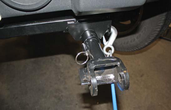 IMPORTANT! Safety cables are required by law. When towing, connect safety cables to the safety cable tab shown in Figure Q.