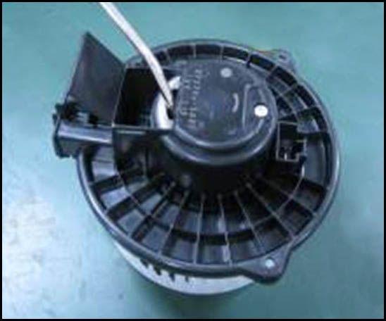 Remove the dust cover on the back of the blower motor. Figure 13.. 22.