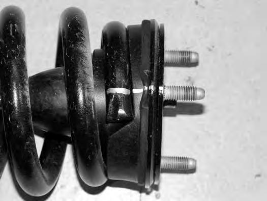 Improper removal/installation of coil spring could result in serious injury or death.
