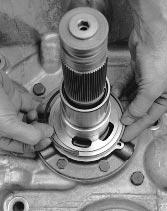 From the input shaft, remove the torque converter retaining snap ring. 7. Mark the location of the input shaft lube slots on the input shaft end. 6 7 8.