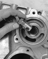 Typical service mechanic tools are needed To Remove. Remove the oil filter adaptor. H/50-8 3.