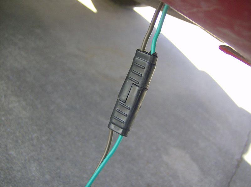 I removed the driver's side kick panel to find the two wires to tap into. For my truck, these wires were Pink/Black and Pink/Orange.