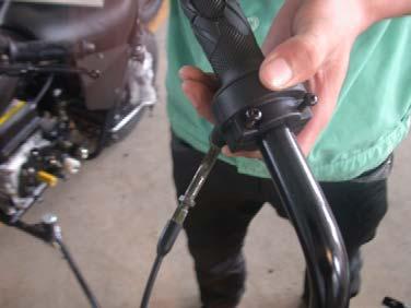 Then tighten the nut on the throttle cable. 2.