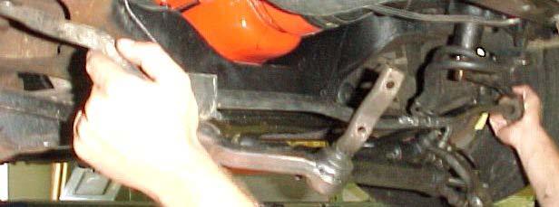 4) With the steering assembly hanging free, you should now be able to