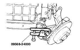 Disconnect the tie rod end ball joint from the knuckle by using the Special Tool (09568-34000).
