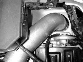 Insert the coupler of the lower intake pipe onto the air flow sensor and secure with the remaining 9448 hose clamp.
