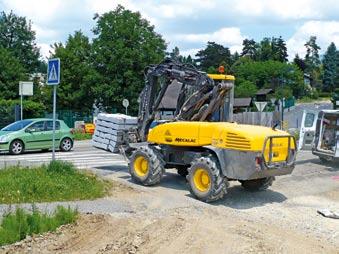 The equipment's versatility enables the operator to swap the back-hoe bucket for forks, the sling guide