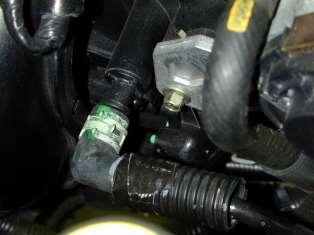Attach the vacuum solenoid to the intake pipe using
