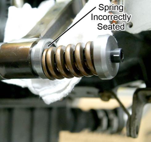 Figure 8 shows incorrect seating of the spring. Figure 7 ST-531 Correctly Installed in the Connecting Rod Figure 8 Spring Incorrectly Seated in the Tool 7.