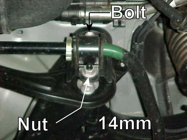 Retain this hardware for reinstallation. 3) Remove the nut and bolt for each side subframe mount using a 14mm socket.