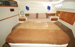 The cabins include two astonishingly large staterooms with generous island beds, and two queen aft cabins. There are two ensuites and a sizeable main bathroom with a separate shower.
