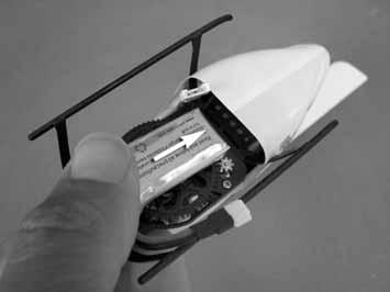 INSTALL THE FLIGHT BATTERY Slide the battery into the helicopter. Make sure the battery is slid all the way to the front of the battery tray.