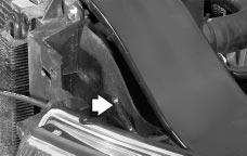 Remove the horizontal pin from the headlamp assembly by lifting the end of the