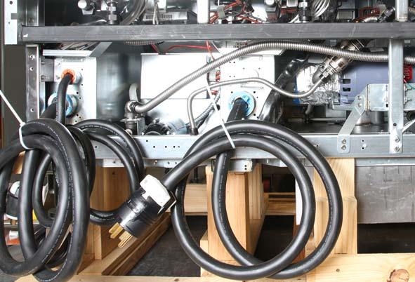Prepare Wiring for Heat Tapes, Routing Inlet and Outlet Oil Pump Lines 1. Locate the plug carrying line voltage to the existing heater tape on the pump. See Figure 19.