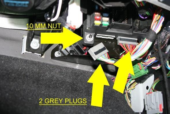After removal, close the CAM Lock so the connectors can be maneuvered out of the way: Disconnect the 2 Grey Connectors