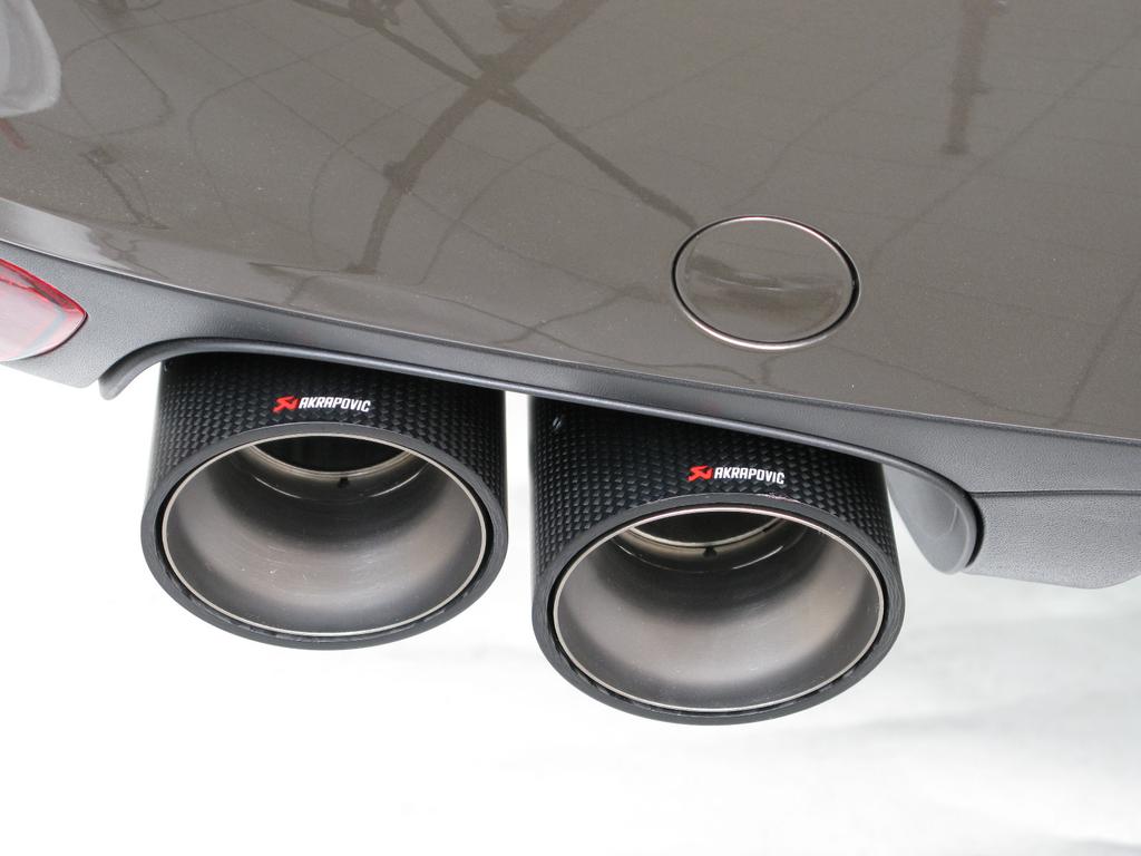 13. For all models: slide the tail-pipes onto the muffler outlets.