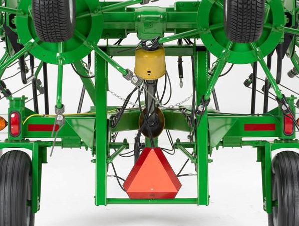 TRANSPORTING Field Transport Never allow any riders on the tractor or the tedder. Remain fully aware of the width of the tedder in relation to objects you are passing.