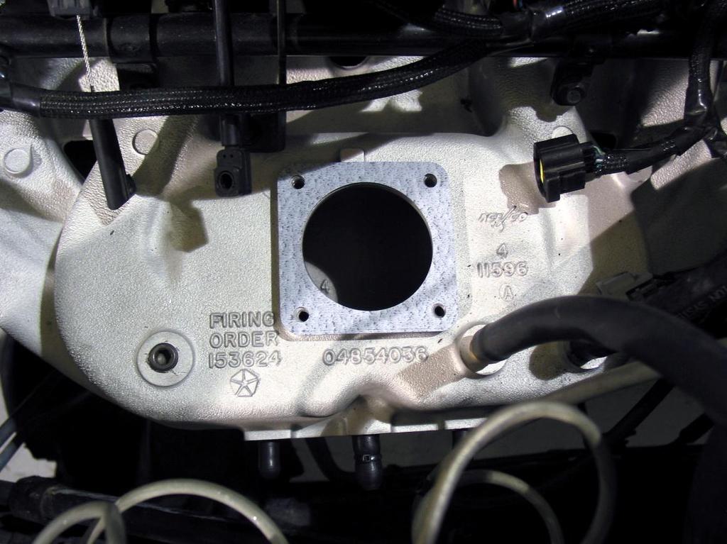the throttle body onto the intake manifold.
