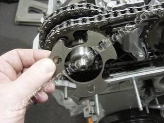 #23 Locate the exhaust sprocket thrust flange and apply a film of oil or assembly lube to both sides.