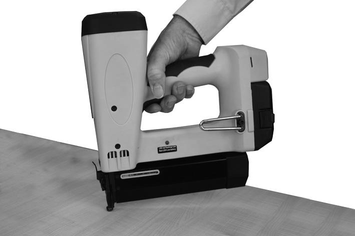 USING THE STAPLER/NAILER 1. Pay attention to the SAFETY INSTRUCTIONS on page3. 2. Hold the tool securely and press the nose against the work as shown.