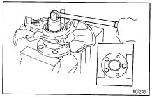 REMOVE FRONT AXLE HUB LOCK NUT AND ABS SPEED SENSOR ROTOR (a) Clamp the axle hub in a soft jaw vise. HINT: Close vise until it holds hub bolt.