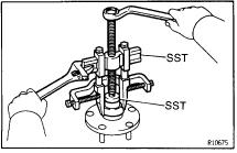 1, install the axle carrier to the vehicle. AXLE HUB DISASSEMBLY 1. REMOVE DUST DEFLECTOR Using a screwdriver, remove the dust deflector. 2.