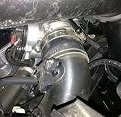 Remove charge pipe from engine bay.