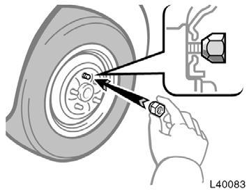 Reinstalling wheel nuts Lowering your vehicle CAUTION Never use oil or grease on the bolts or nuts. Doing so may lead to overtightening the nuts and damaging the bolts.