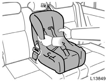 While pressing the convertible seat firmly against the seat cushion and seatback, let the shoulder belt retract as far as it will go to hold the