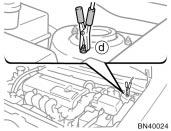Connect the clamp at the other end of the negative (black) jumper cable to a solid, stationary, unpainted, metallic point of the vehicle with the discharged battery.