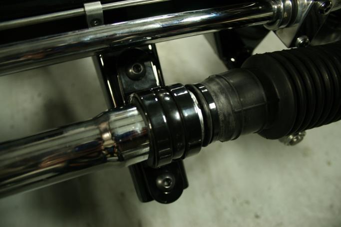 Installing the rack and pinion: Place the rack on the cross member brackets as shown.