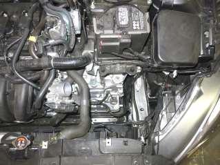 Remove the upper air box and intake hose assembly from