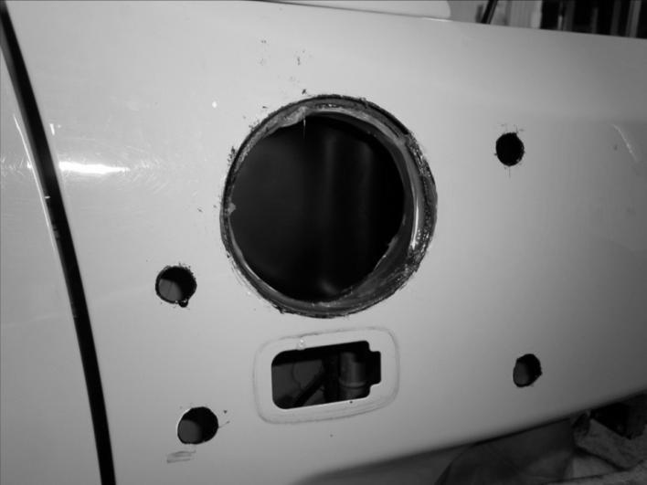 Using the holes in the snorkel bracket as a template, mark the three hole positions onto the windscreen pillar. 49.