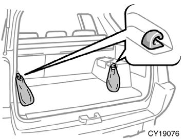 CAUTION To avoid personal injury, keep the tie down hooks folded in place on the floor when not in use.
