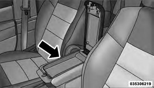 To open the upper storage compartment, push inward on the upper handle to unlatch the upper lid and lift the