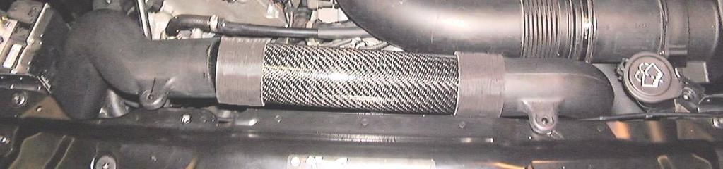 Slip the carbon fiber center tube into position and slide the silicone hose onto the left tube.