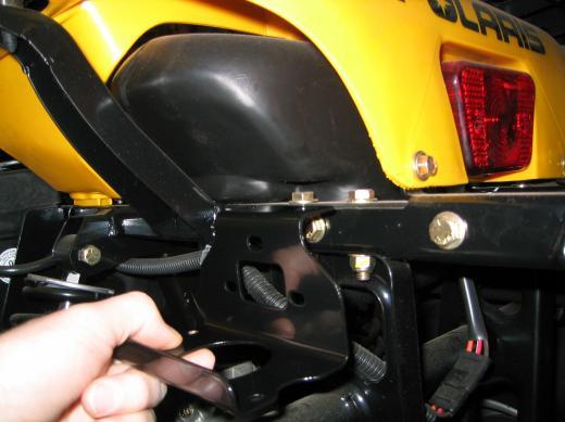 2. Fasten the contactor mount to the left-hand side of the ATV s rear frame utilizing the existing hardware on the vehicle, Picture 9. Use Existing 3 Bolts On Machine to Mount Contactor Picture 9 3.